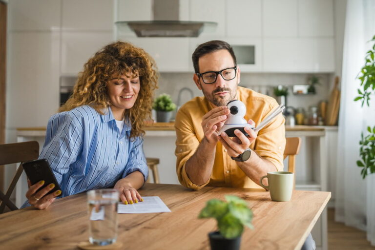 Couple at home connect and install cctv security surveillance camera